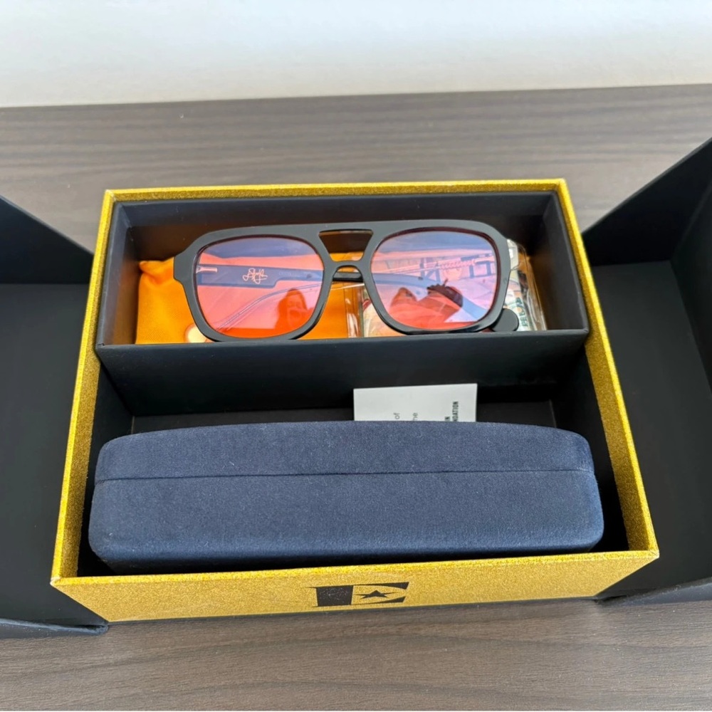 Stylish Black Sunglasses with Orange Lenses